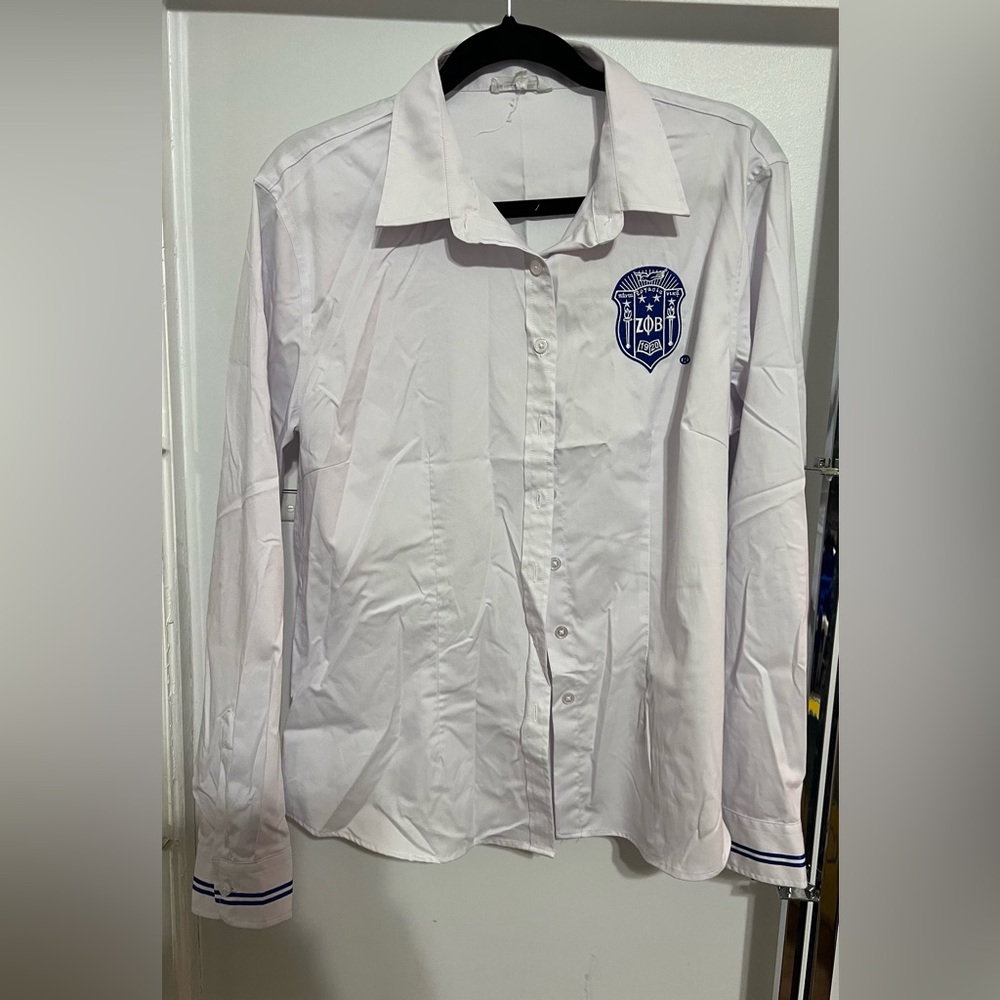Zeta Phi Beta Sorority women’s shirt with blue sorority shield.